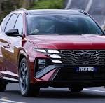Rental car Tbilisi Hyundai Tucson and SUV's driving through the Caucasus mountains.