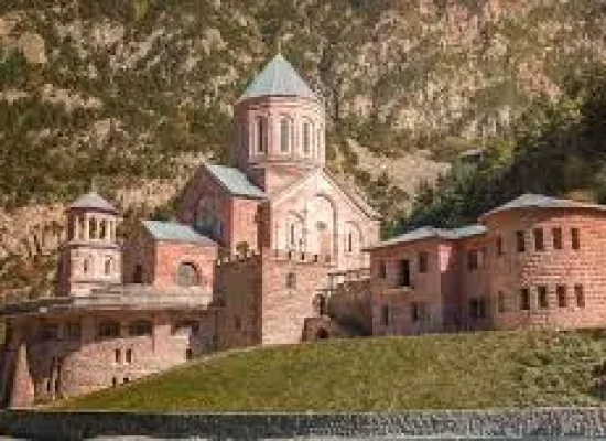Dariali Gorge in Kazbegi Georgia with dramatic cliffs and river landscape along Georgian Military Highway