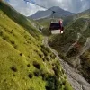 Georgian Military Highway road to Kazbegi with mountain views, scenic drive from Tbilisi by rental car